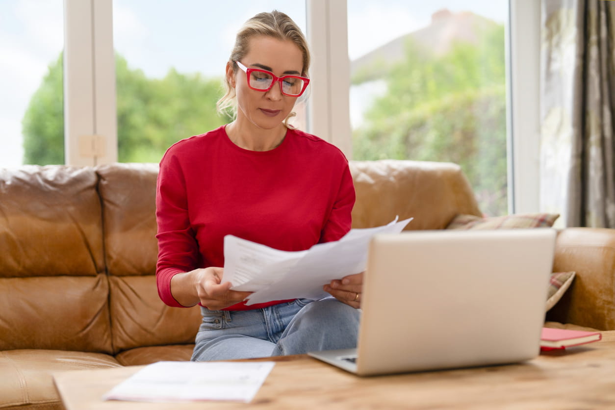 A woman reading through documents