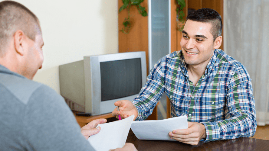 Two tenants reading through their new tenancy agreement